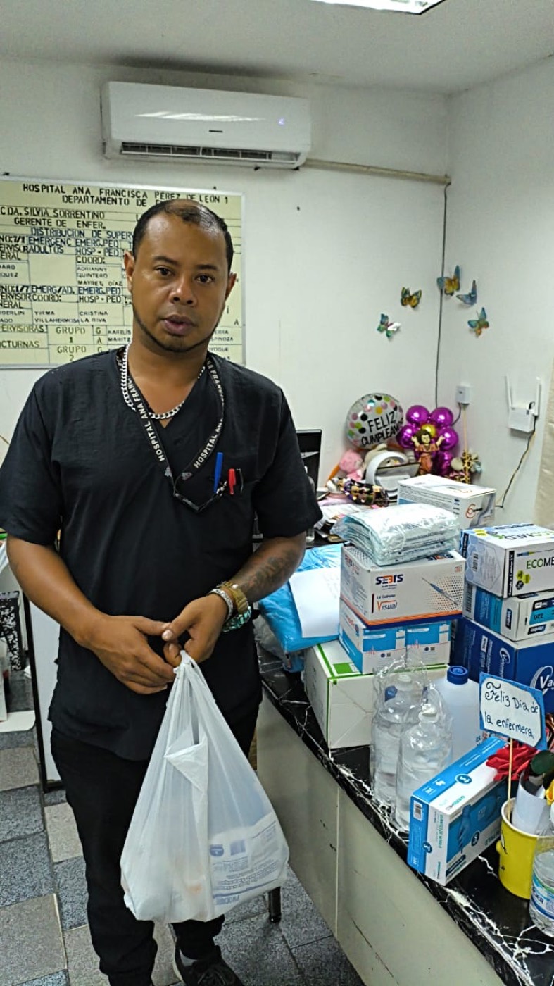 Handing medical supplies to hospital staff.