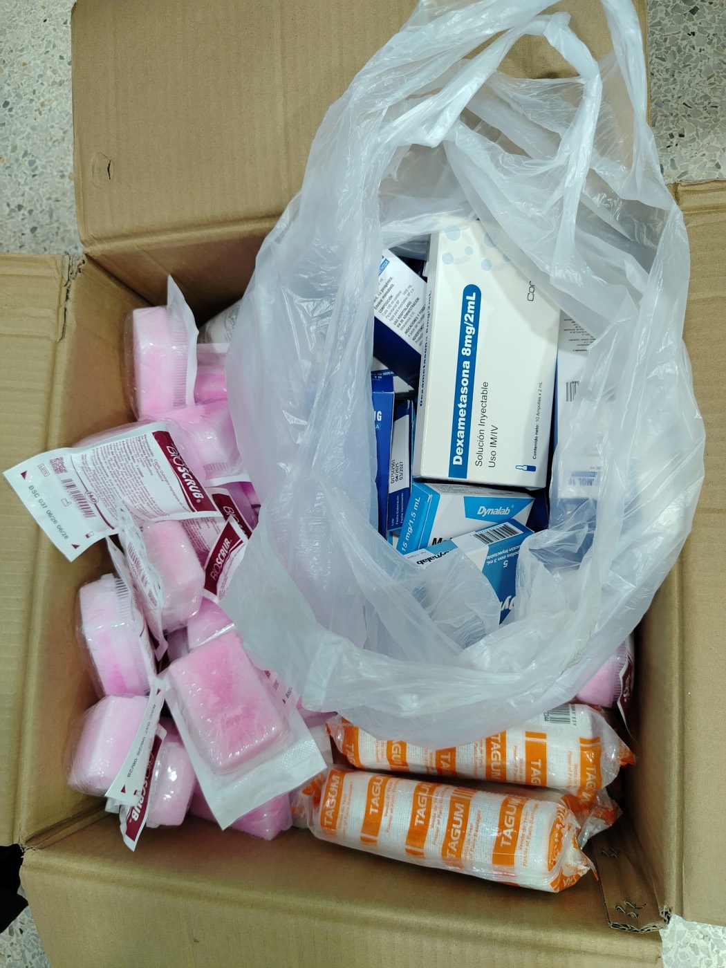 A box of medicine and medical supplies ready for delivery.