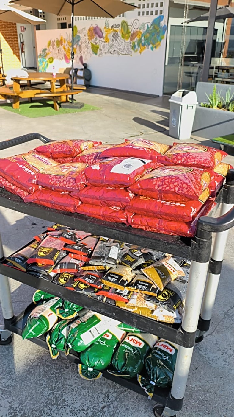 A cart of food (rice, pasta and grains) ready to distribute.
